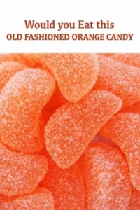 Homemade old fashioned orange candy with vibrant orange slices and a sugary coating.
