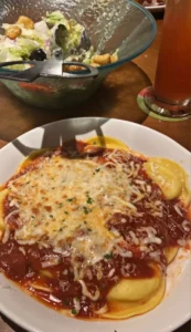 Delicious Olive Garden pasta dish served with fresh ingredients and breadsticks