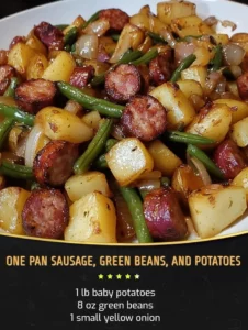 One pan meal of sausage, green beans, and potatoes cooked together.