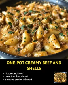 One-Pot Creamy Beef and Shells in a skillet with cheese and herbs