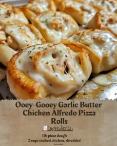 Garlic Butter Chicken Alfredo Pizza Rolls topped with cheese and herbs