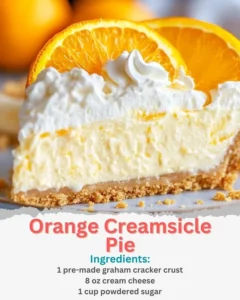 Delicious Orange Creamsicle Pie topped with whipped cream and orange slices
