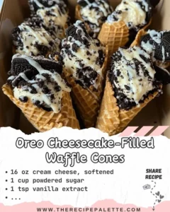 Delicious Oreo cheesecake-filled waffle cones topped with whipped cream.
