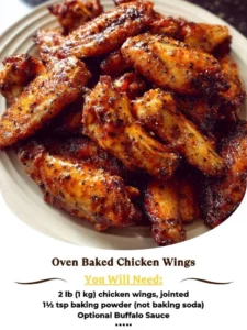 Crispy oven baked chicken wings garnished with herbs