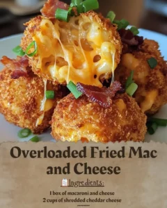 Overloaded Fried Mac and Cheese served on a plate, topped with crispy toppings.