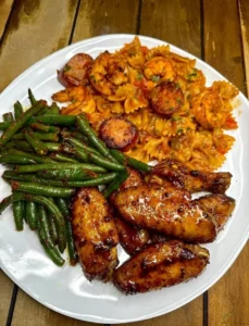 Plate of Pastalaya with Wings, showcasing vibrant colors and delicious ingredients.