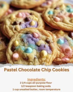 Pastel chocolate chip cookies on a plate, perfect for a colorful treat.