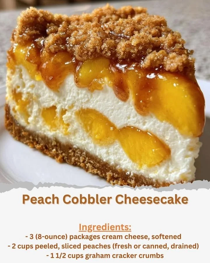 Delicious slice of peach cobbler cheesecake with peaches and a crumbly topping