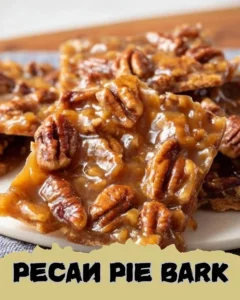 Delicious Pecan Pie Bark with chocolate and pecans on a wooden board