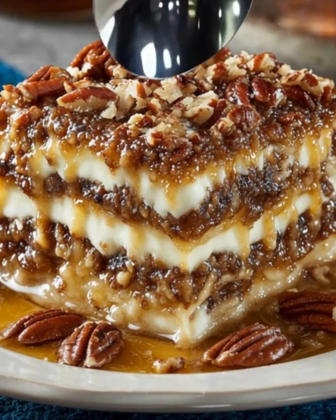 Delicious Pecan Pie Lasagna with layers of creamy filling and pecan topping
