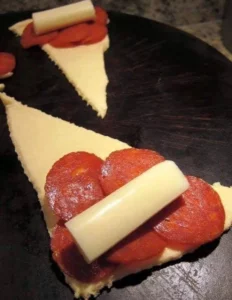 Delicious Pepperoni Crescent Rolls freshly baked and served as a snack or appetizer.