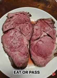 Perfectly cooked prime rib roast served with sides.