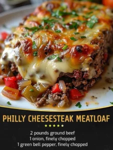 Delicious Philadelphia cheesesteak meatloaf served with melted cheese and peppers