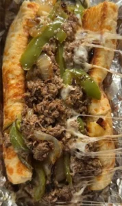Delicious Philly Cheesesteak sandwich with steak, cheese, and toppings
