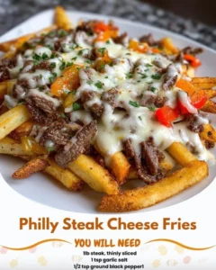 Delicious Philly steak cheese fries topped with melted cheese and fresh steak