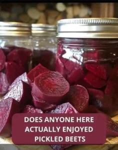 Jar of homemade pickled beets with spices and herbs