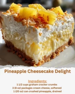 Slice of Pineapple Cheesecake Delight topped with fresh pineapple and whipped cream