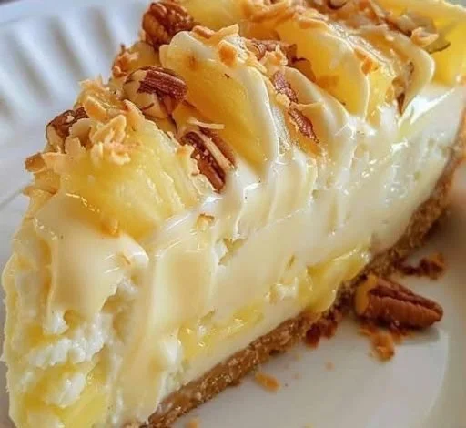 Pineapple Cream Cheese Pie slice on a plate with fresh pineapple garnish