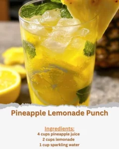 Refreshing Pineapple Lemonade Punch served in a glass with fruit garnishes.