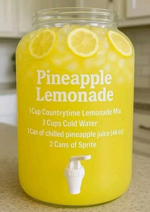 Delicious glass of homemade pineapple lemonade with fresh fruit garnishes