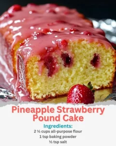 Slice of Pineapple Strawberry Pound Cake on a wooden table