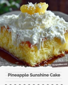 Delicious Pineapple Sunshine Cake topped with fresh pineapple slices and whipped cream