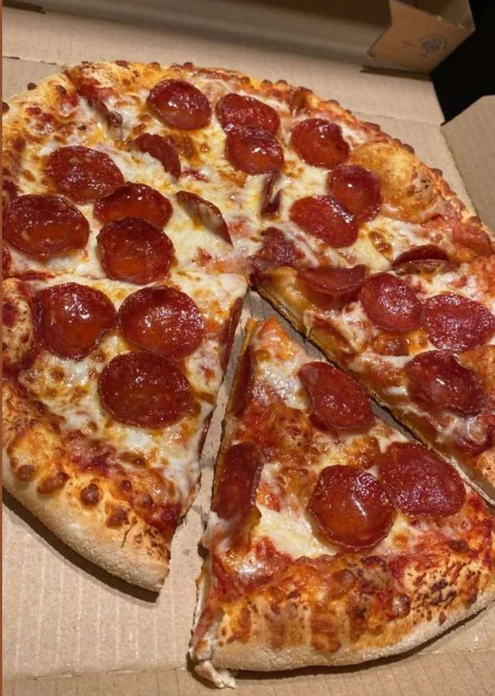 Delicious pizza and wings combo ready to be enjoyed