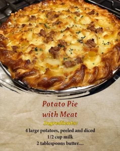 Delicious Potato Pie with Meat served on a plate, garnished and ready to enjoy.
