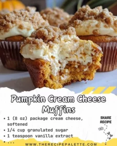 Freshly baked Pumpkin Cream Cheese Muffins arranged on a wooden platter