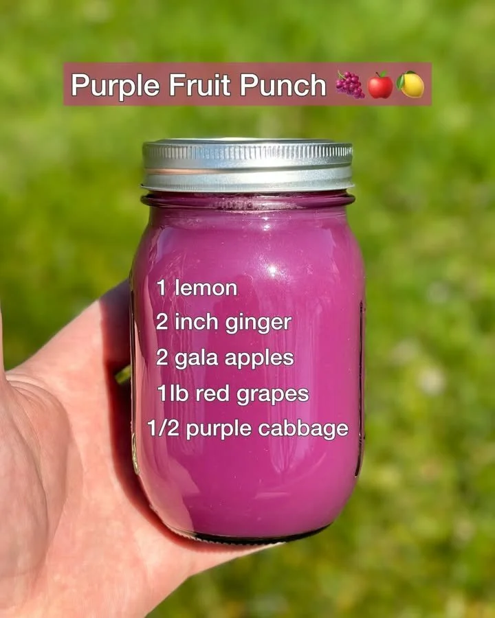 Purple Fruit Punch drink served in a glass with colorful fruits