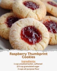 Plate of homemade Raspberry Thumbprint Cookies with raspberry jam filling