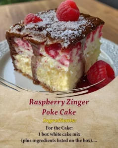 Moist Raspberry Zinger Poke Cake topped with creamy raspberry frosting