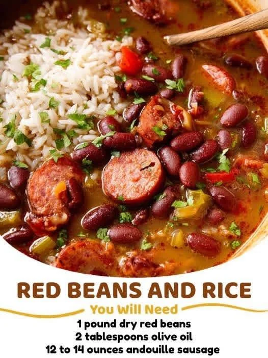 Bowl of red beans and rice with fresh herbs and spices.