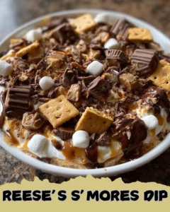 Delicious Reese's S’mores Dip served with crackers and marshmallows