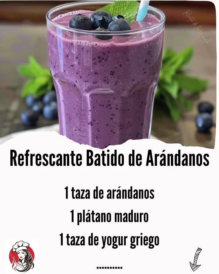 Refreshing blueberry smoothie in a glass with fresh blueberries