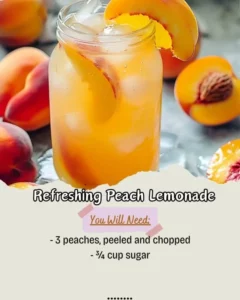 Glass of refreshing peach lemonade garnished with fresh peaches and mint