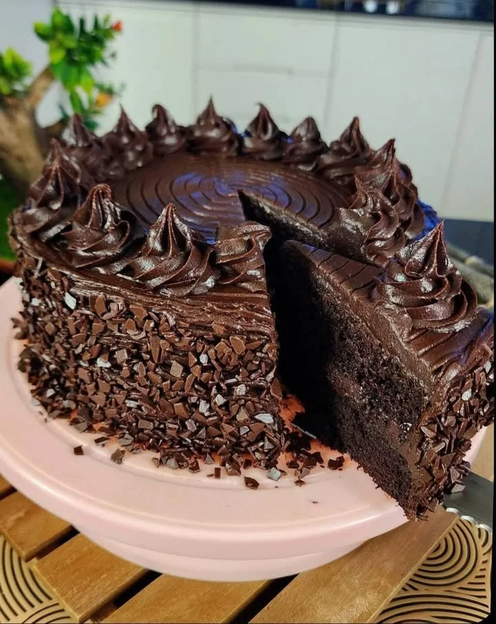 Rich double chocolate cake with moist filling, perfect for chocolate lovers