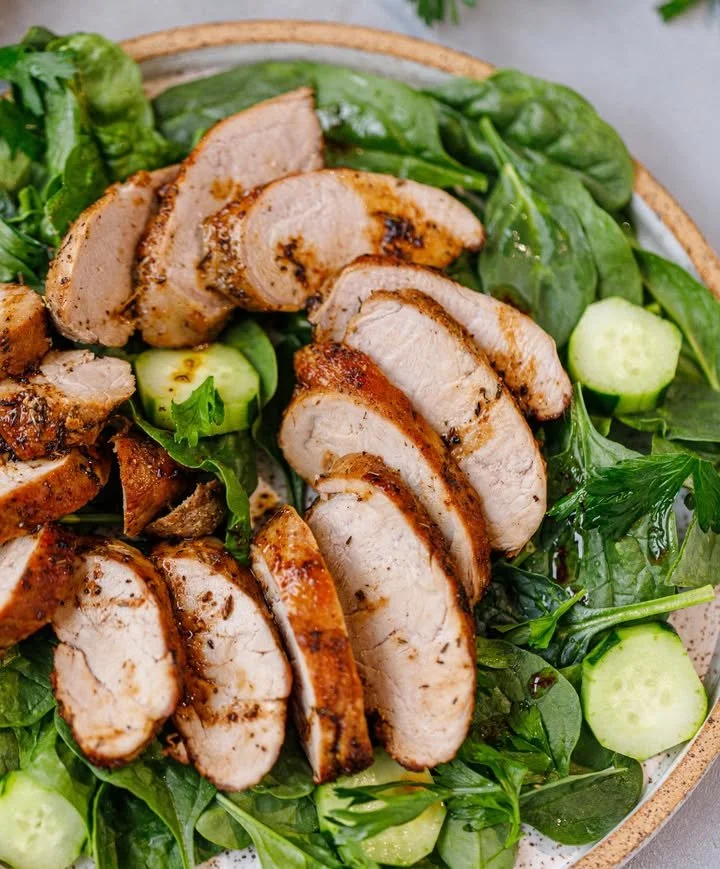 Juicy and flavorful roasted pork tenderloin served on a platter.