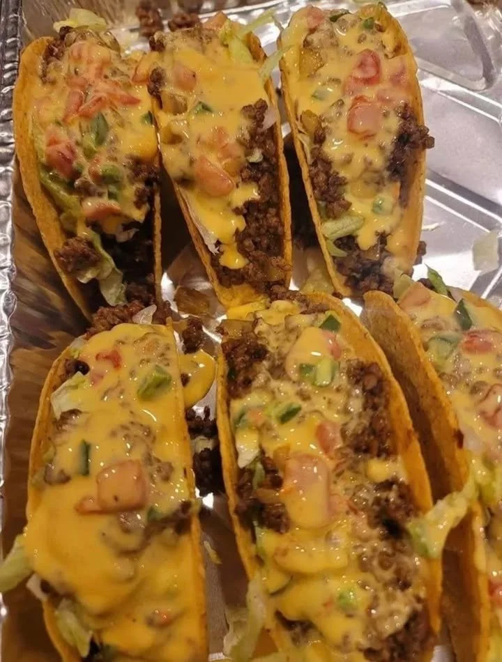 Plated Rotel Tacos with toppings ready to serve
