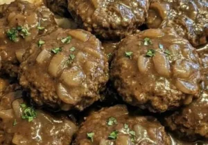 Hearty Salisbury steak served with rich mushroom gravy on a plate