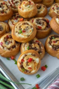Delicious sausage pinwheels appetizer on a serving platter