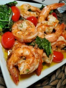 Delicious sautéed shrimp with fresh spinach served on a plate