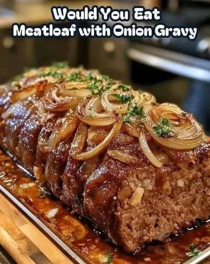 Savory meatloaf with caramelized onion gravy served on a plate