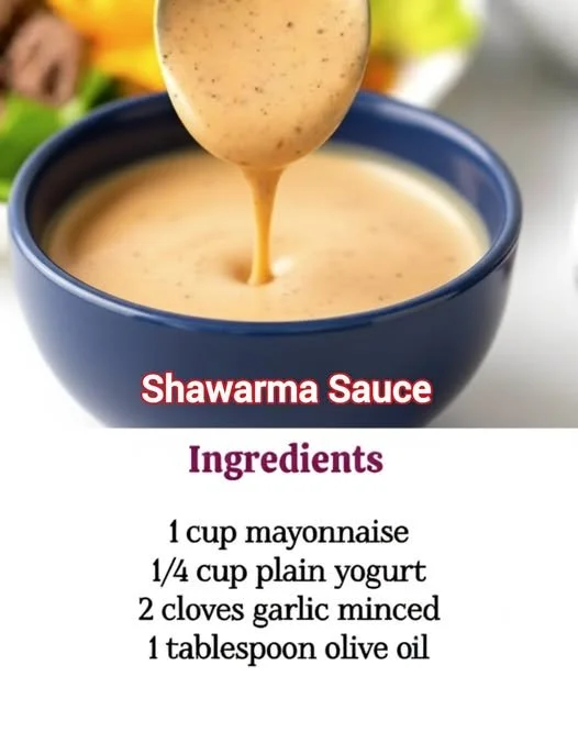 Delicious homemade shawarma sauce in a bowl with fresh herbs.