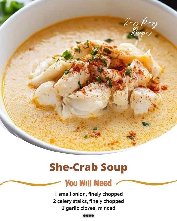 Rich and creamy She-Crab Soup garnished with crab meat and herbs