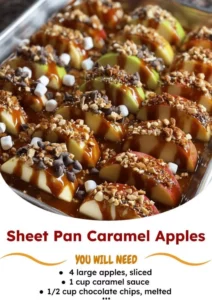Sheet pan caramel apples topped with nuts and drizzled with caramel.