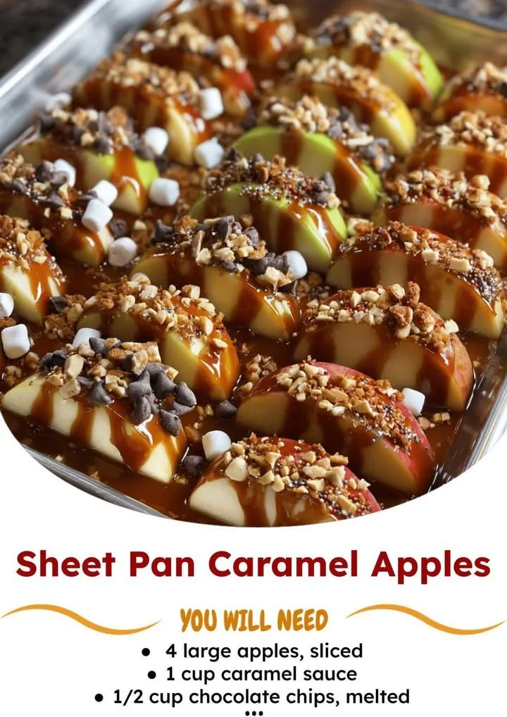 Sheet pan caramel apples topped with nuts and drizzled with caramel.