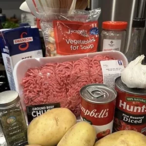 Shepherd's Pie Stuffed Baked Potatoes topped with creamy mashed potatoes and herbs