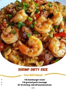 A plate of shrimp dirty rice garnished with fresh herbs and spices.