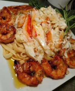 Delicious shrimp fettuccine served with creamy sauce and herbs
